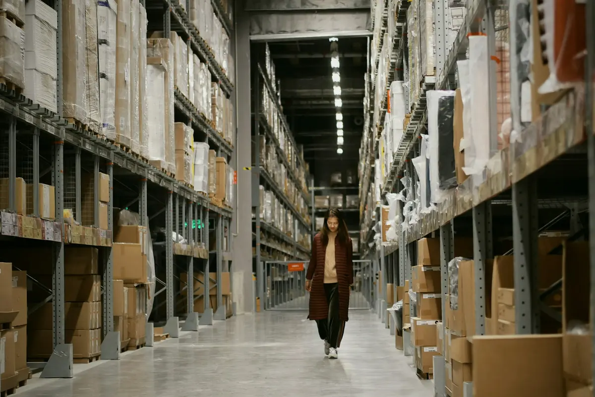 A warehouse aisle, stacked to the roof
