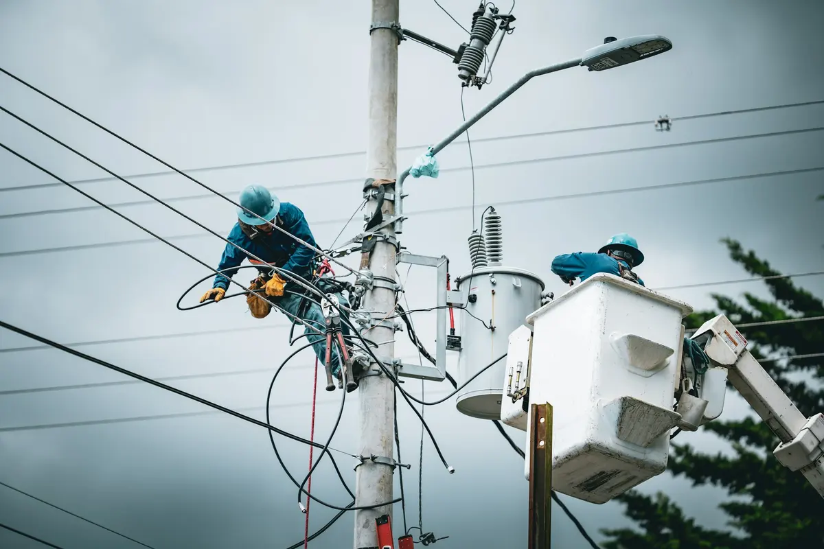 Linemen at work on a pole