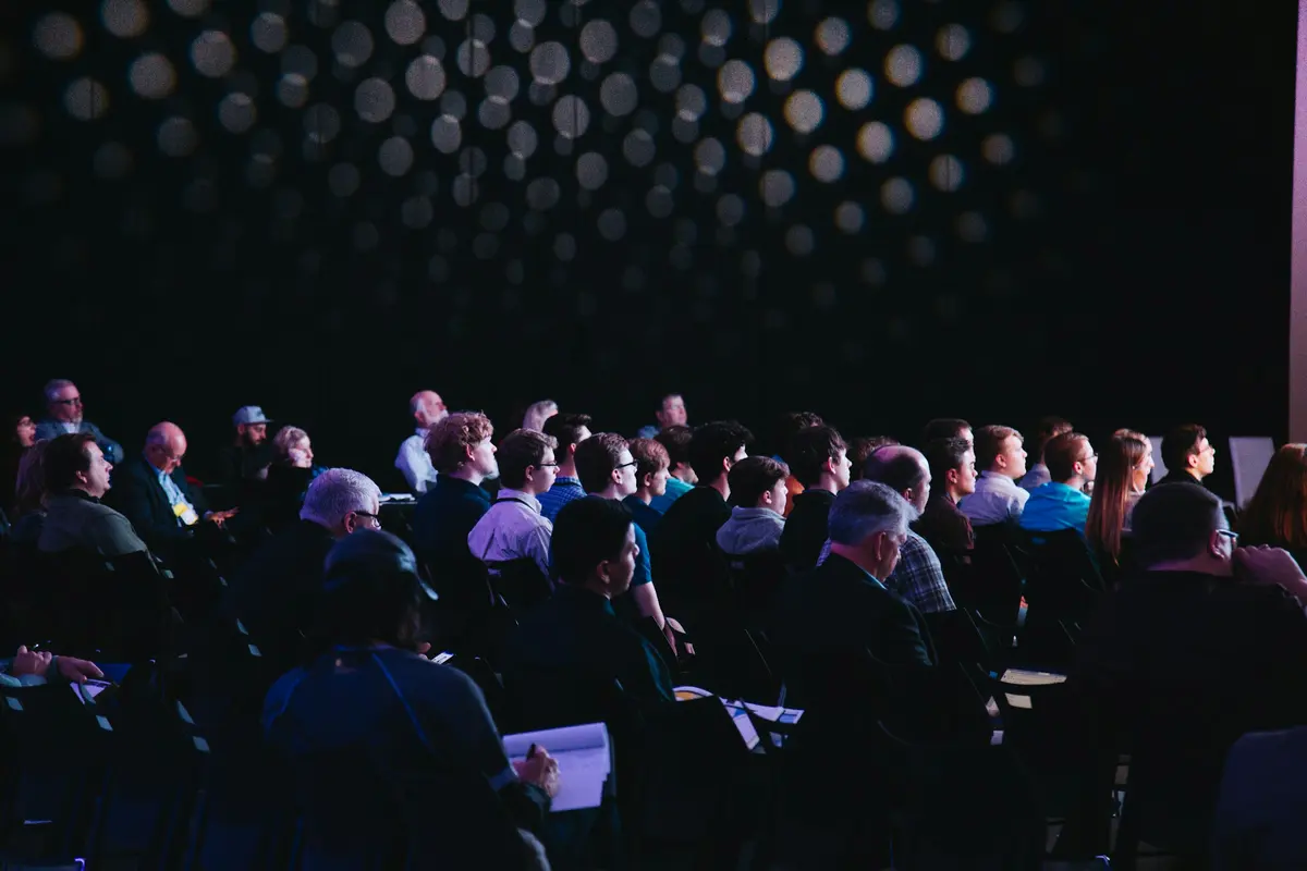An audience, listening
