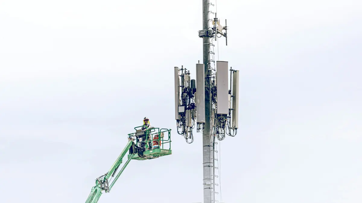 A technician at a mobile tower
