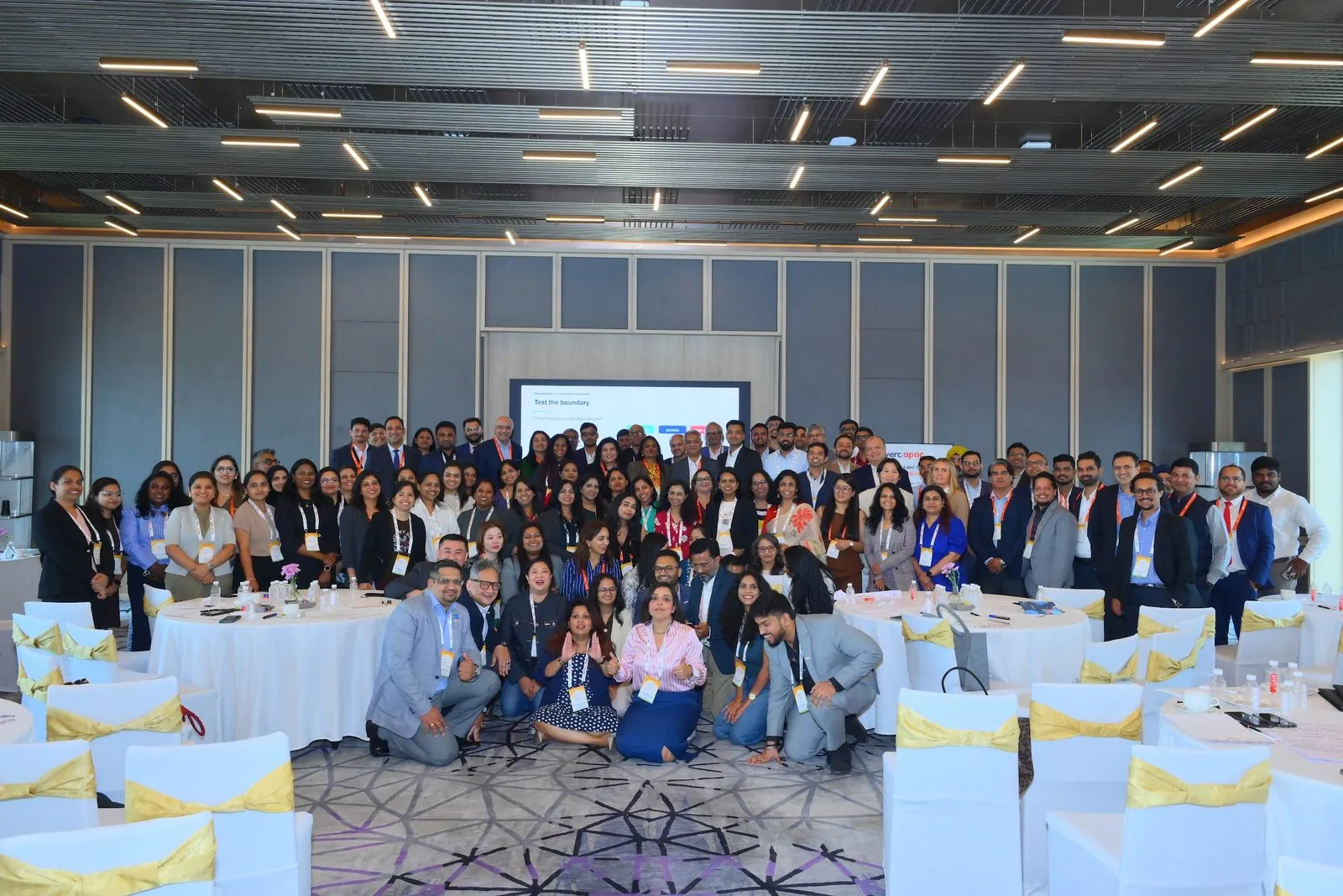 A full conference room in Bengaluru, people from across one industry, together for the photograph